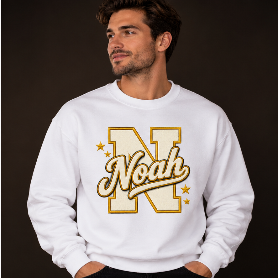 White personalized crewneck on a model, example name Noah