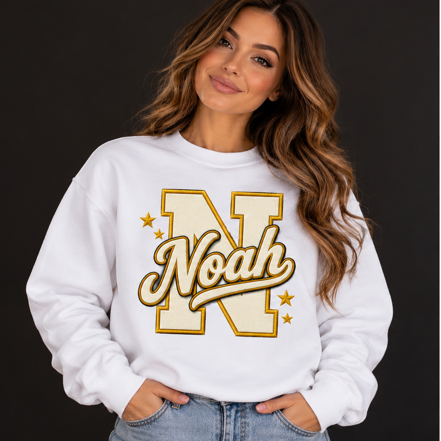White personalized crewneck on a model, example name Noah